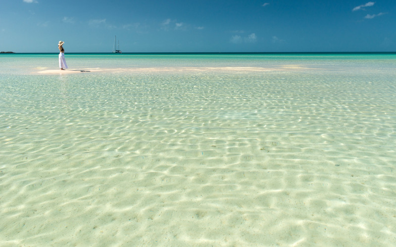 governors harbour beach with sailing boat